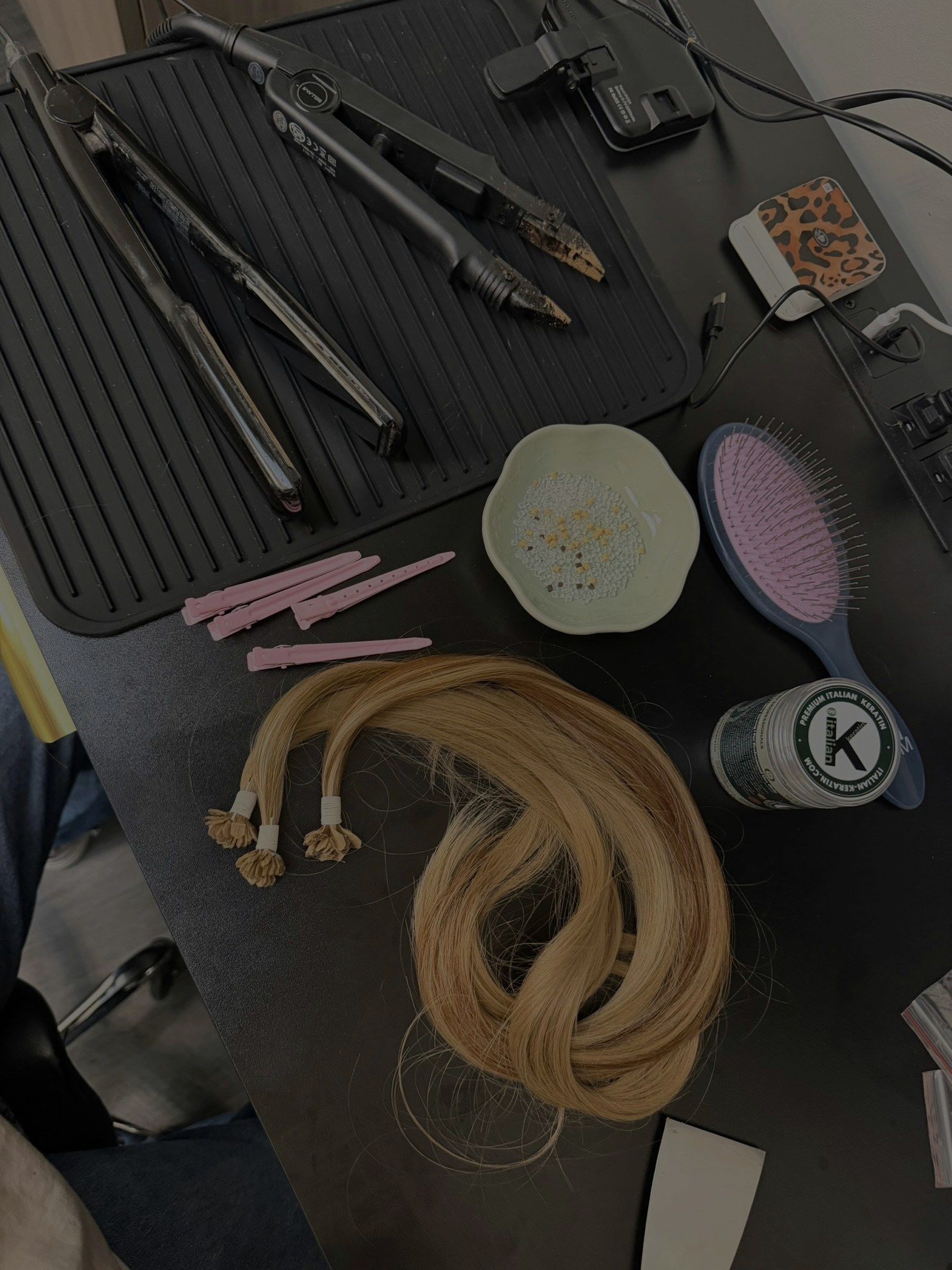 Bond-making setup with tools and blonde keratin-tip hair