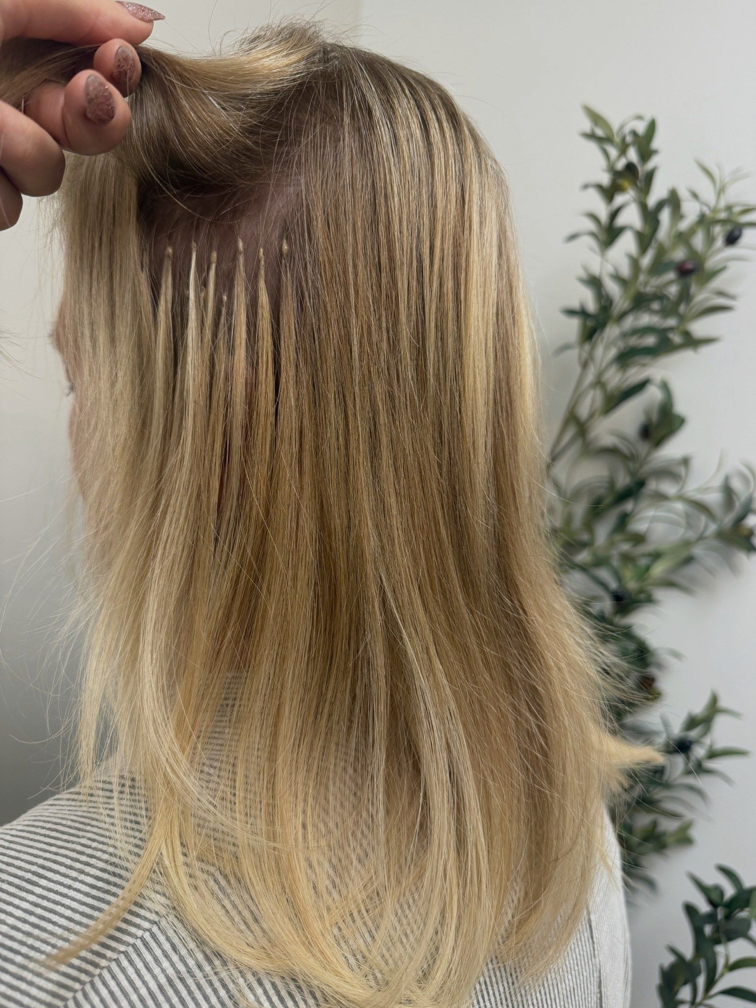 A low-density row of keratin bonds sitting flat against fine natural hair