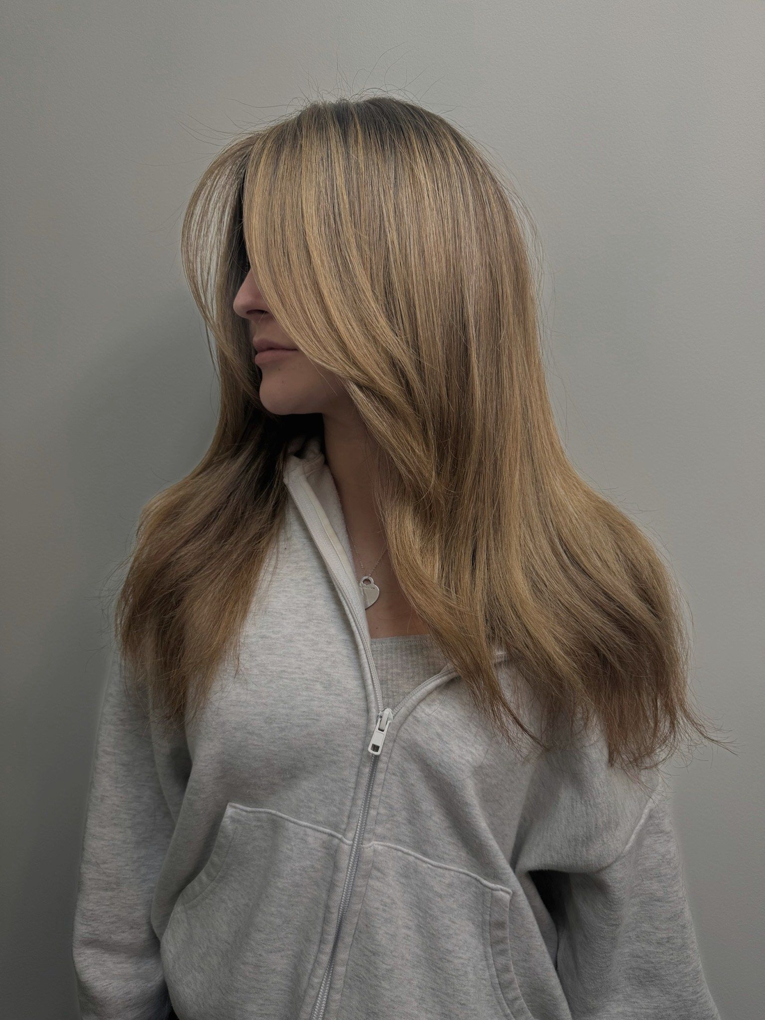 Golden brown custom balayage with long curtain layers